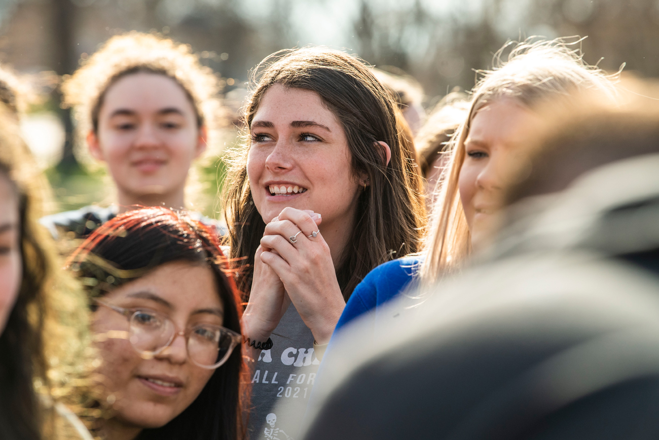 A group of students at an event on campus during the spring