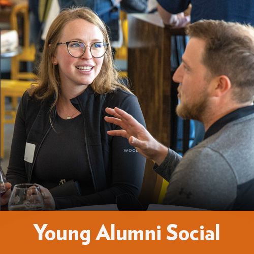 Young Baker alums networking at an event