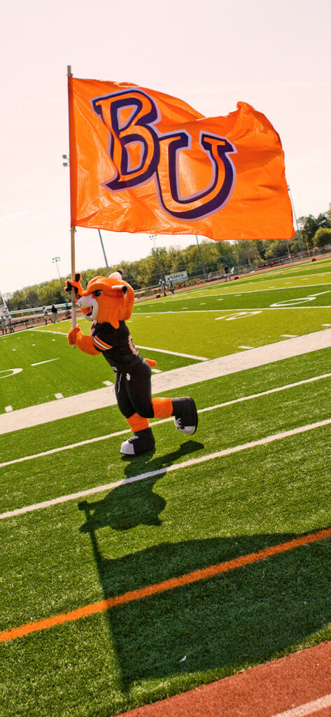 phone screensaver with Wowzor waving Baker flag on football field