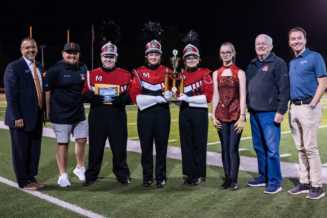 McPherson marching band leaders receiving Jeremy Frye award.